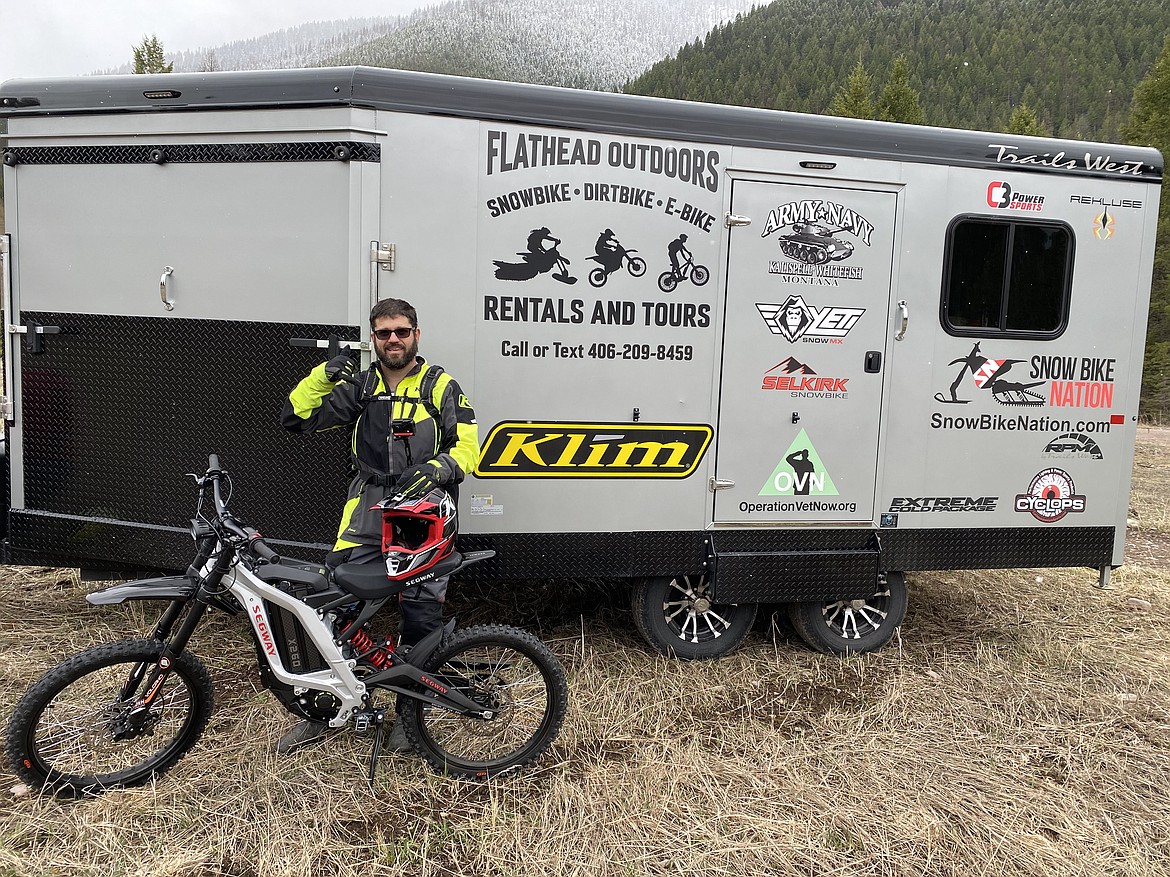 Kyle Allred poses outside the Flathead Outdoors trailer, which equips rider with all the gear for an adventure in the woods (courtesy photo).