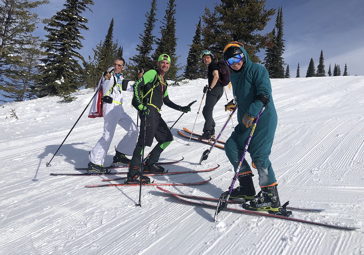 Chance Cooke wears an Elvis suit and skis with a group of friends on the day of the DREAM Adaptive Shred-A-Thon fundraiser at Whitefish Mountain Resort in March. From left to right, Chance Cooke, Jeff Brown, Loren Mason-Gere, and Stacy Jaquith. (Photo courtesy of DREAM Adaptive)