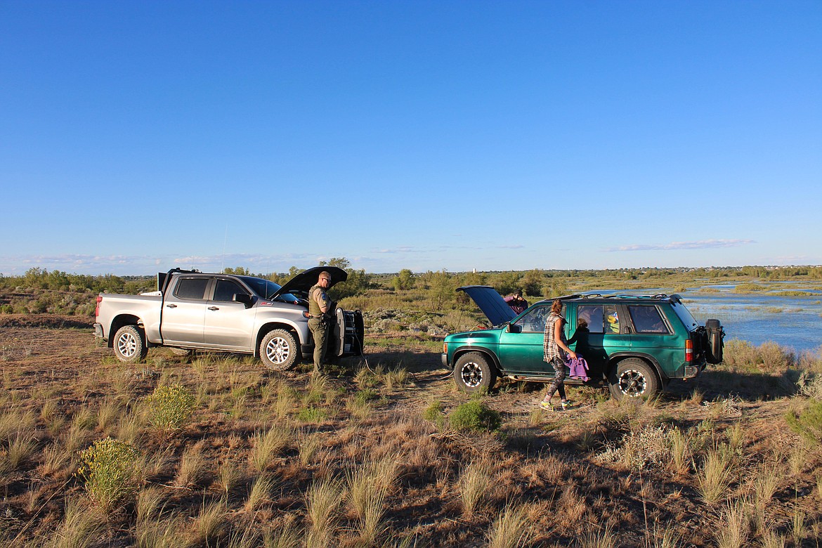 Sgt. Chris Busching jumps a car that’s illegally parked off-road near the Crab Creek Overlook outside of Moses Lake.