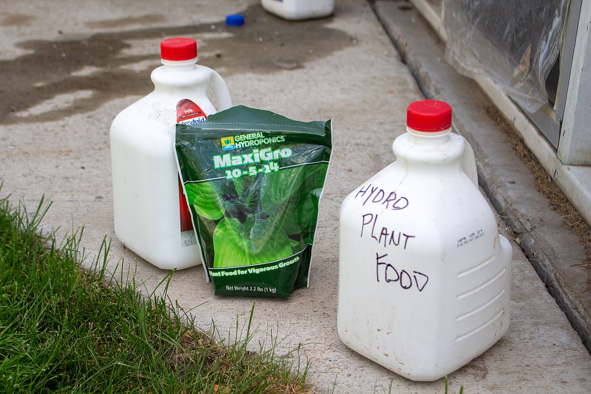 Ken Rosecrans’ hydroponic nutrient mix and liquid mix containers sit on his back patio behind his home in Moses Lake.