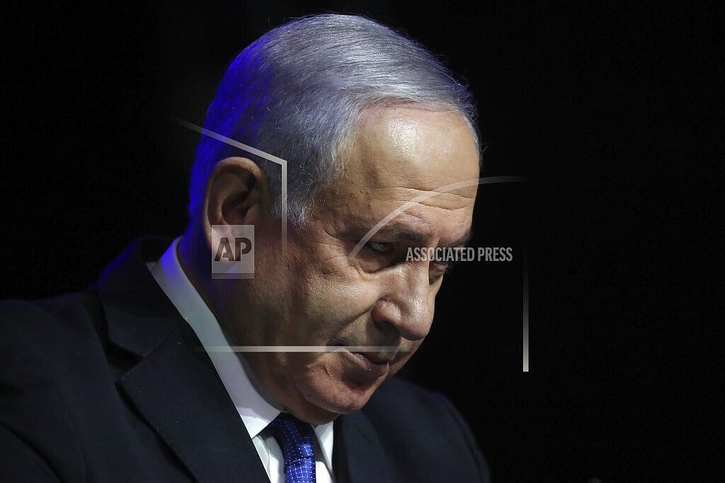 FILE - In this June 6, 2021 file photo, Israeli Prime Minister Benjamin Netanyahu speaks at a ceremony showing appreciation to the health care system for their contribution to the fight against the coronavirus, in Jerusalem. In what appear to be the final days of his historic 12-year rule, Netanyahu is not leaving the political stage quietly. (AP Photo/Ariel Schalit, File)