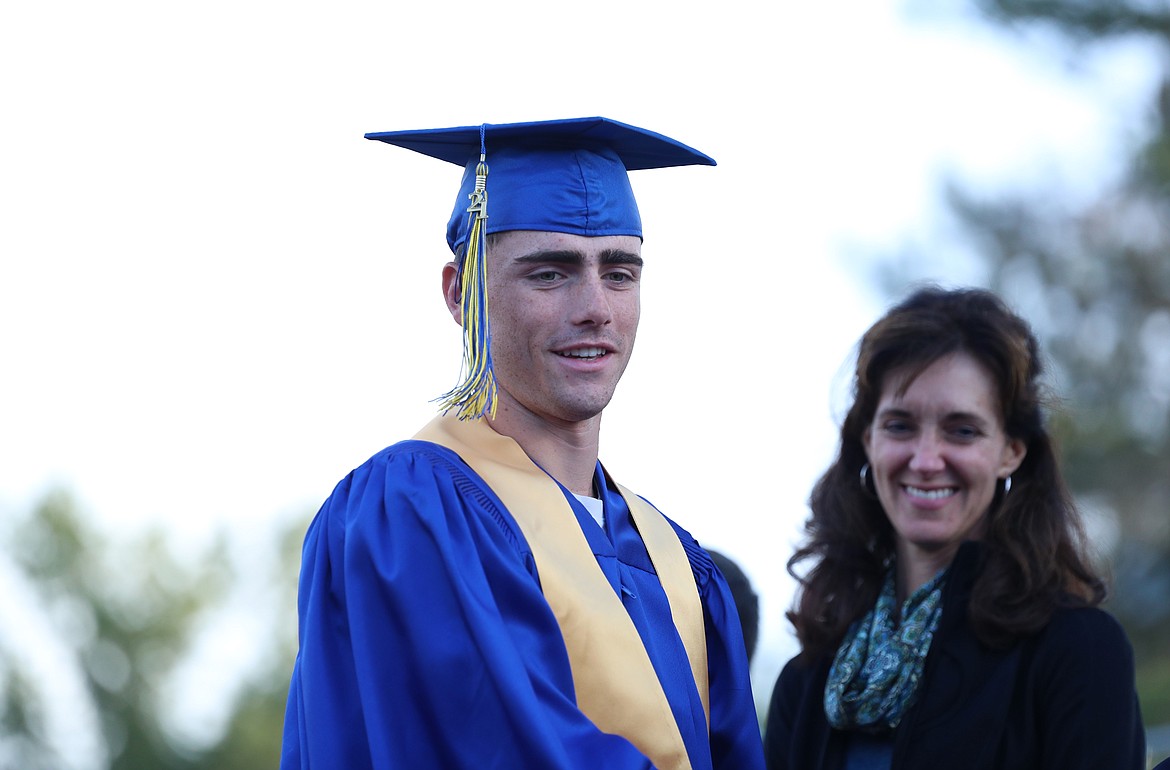 Cameron Garcia smiles before receiving his diploma.