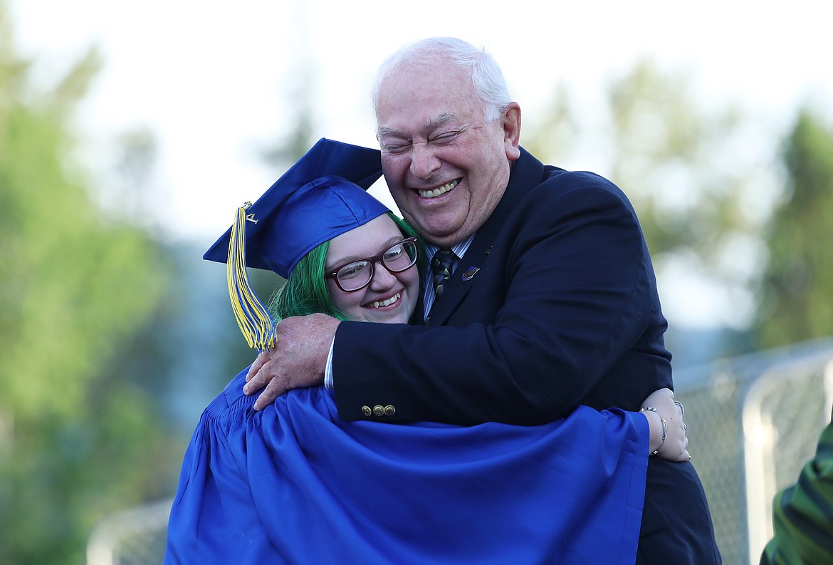 Lilyana McKinney hugs Purley Decker, a member of the Lake Pend Oreille School Board, prior to receiving her diploma on Wednesday.