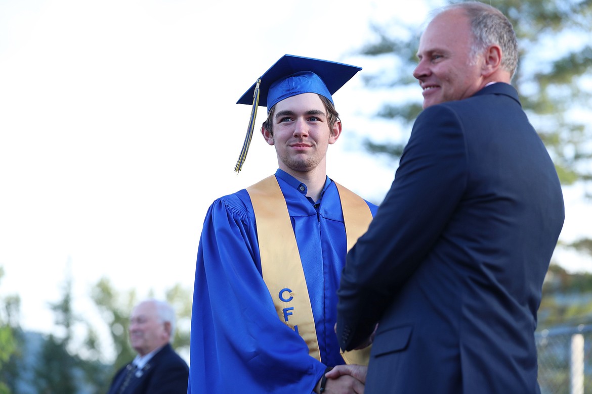 Matthew Hobbs receives his diploma.