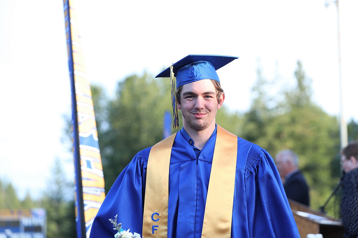 Matthew Hobbs walks off with his diploma.