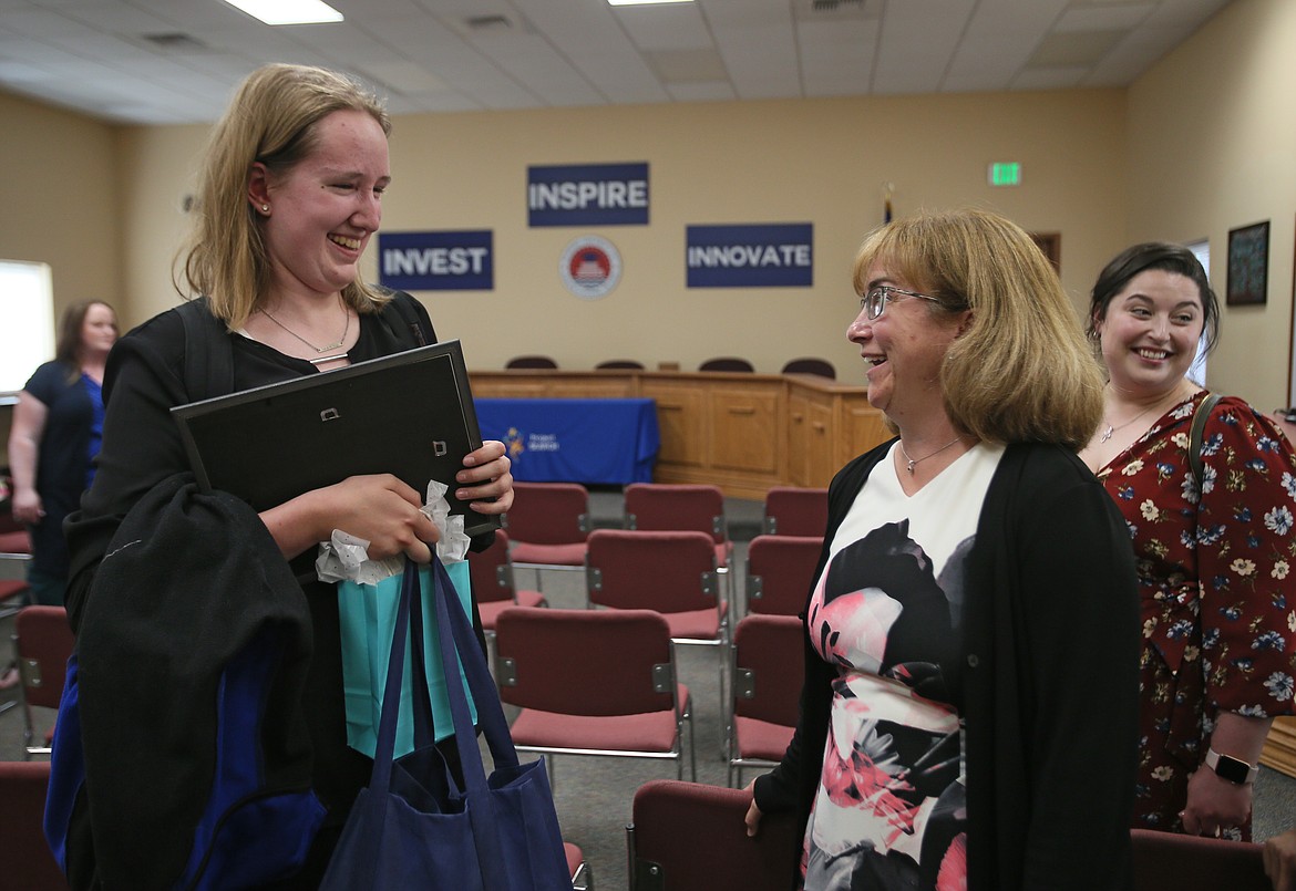 Anastasia Johnson shares a moment with instructor Theresa Moran after graduating from Project SEARCH on Wednesday. Anastasia is one of 11 students who graduated in the 11th year of the program.