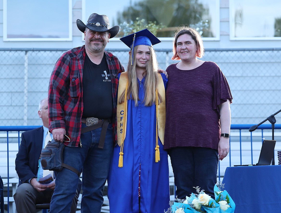 Reba Decker poses for a photo with family after receiving her honors cord.