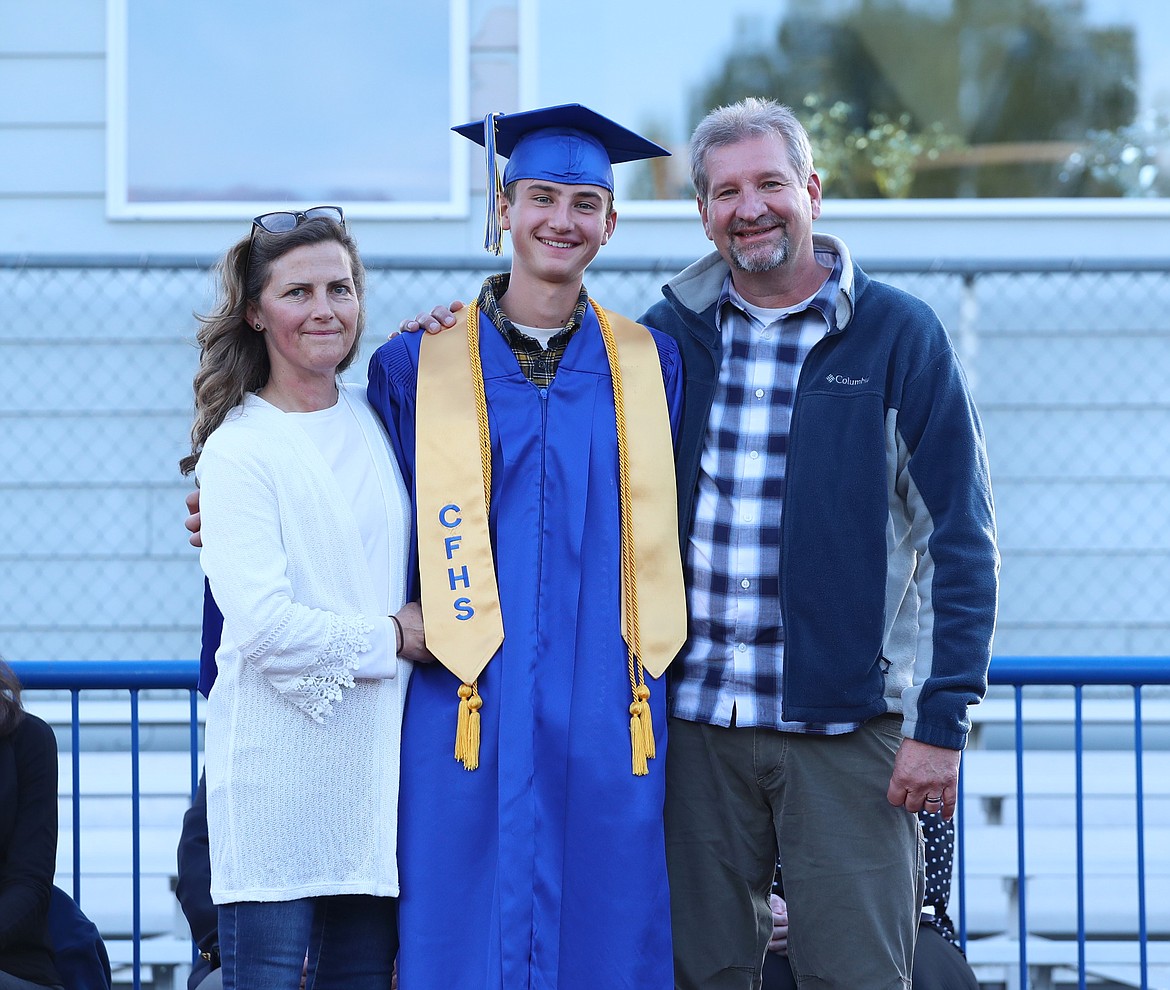 Wesley Simko poses for a photo with family after receiving his honors cord.