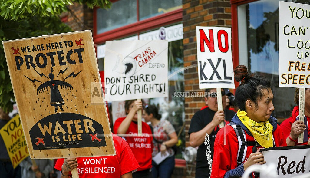 In this Jun 12, 2019, file photo, walking up Main Street the procession protesting against the Keystone XL pipeline makes its way to Andrew W. Bogue Federal Courthouse in Rapid City, S.D. The sponsor of the Keystone XL crude oil pipeline says it's pulling the plug on the contentious project, Wednesday, June 9, 2021, after Canadian officials failed to persuade the Biden administration to reverse its cancellation of the company's permit.(Adam Fondren/Rapid City Journal via AP)