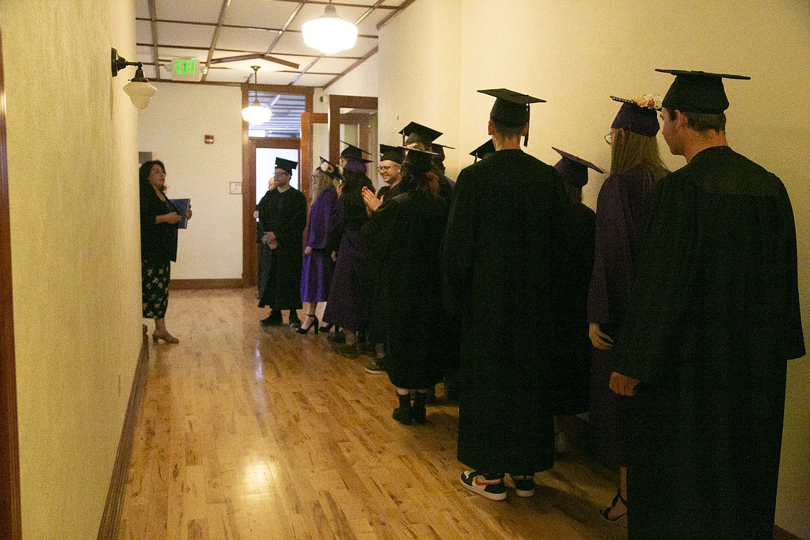 Lake Pend Oreille High School soon-to-be graduates wait in the hallway for their commencement ceremony to begin as the school celebrated its 26 graduates on Thursday.