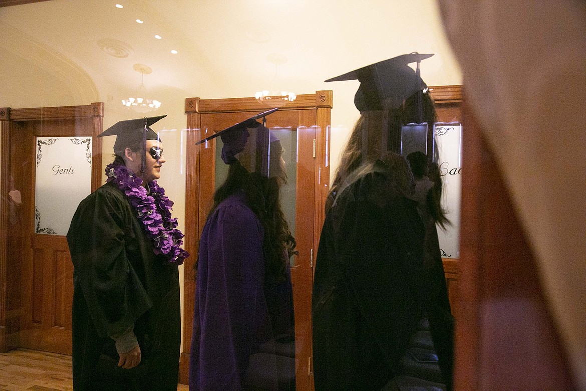 Lake Pend Oreille High School soon-to-be graduates walk toward the ceremony. LPOHS presented its 26 graduates with diplomas at Thursday's commencement ceremony. Each graduate also received personalized gifts and remarks from staff members recounting their most notable moments.