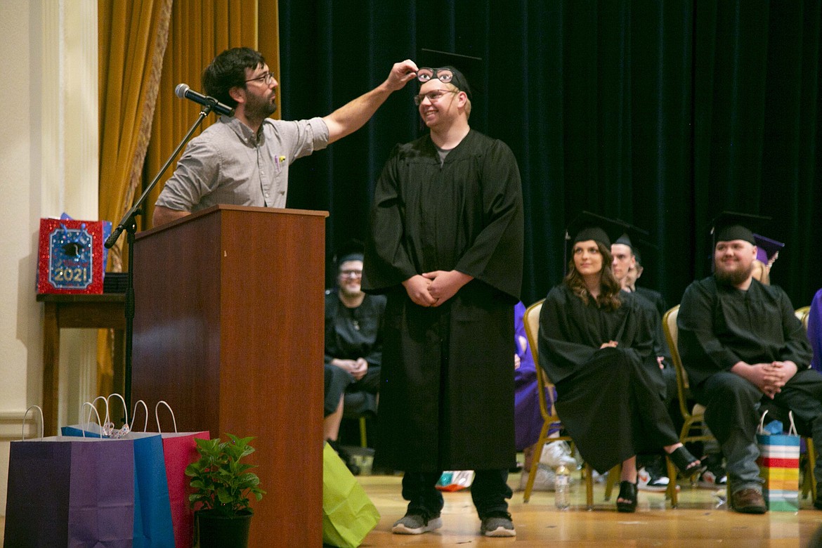 A Lake Pend Oreille High School graduate is presented with a pair of funny eyeglasses. LPOHS presented its 26 graduates with diplomas at Thursday's commencement ceremony. Each graduate also received personalized gifts and remarks from staff members recounting their most notable moments.