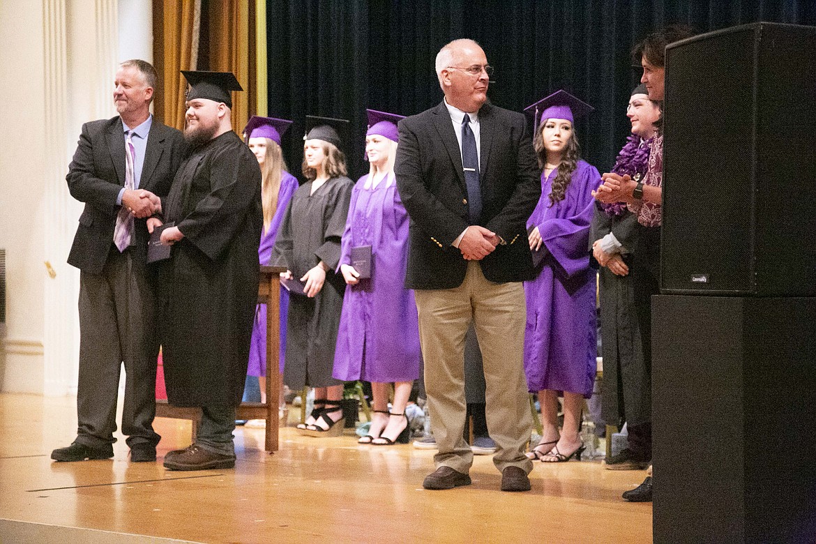 A Lake Pend Oreille High School graduate gets his diploma. LPOHS presented 26 graduates with diplomas at Thursday's commencement. Each graduate also received personalized gifts and remarks from staff members recounting their most notable moments.