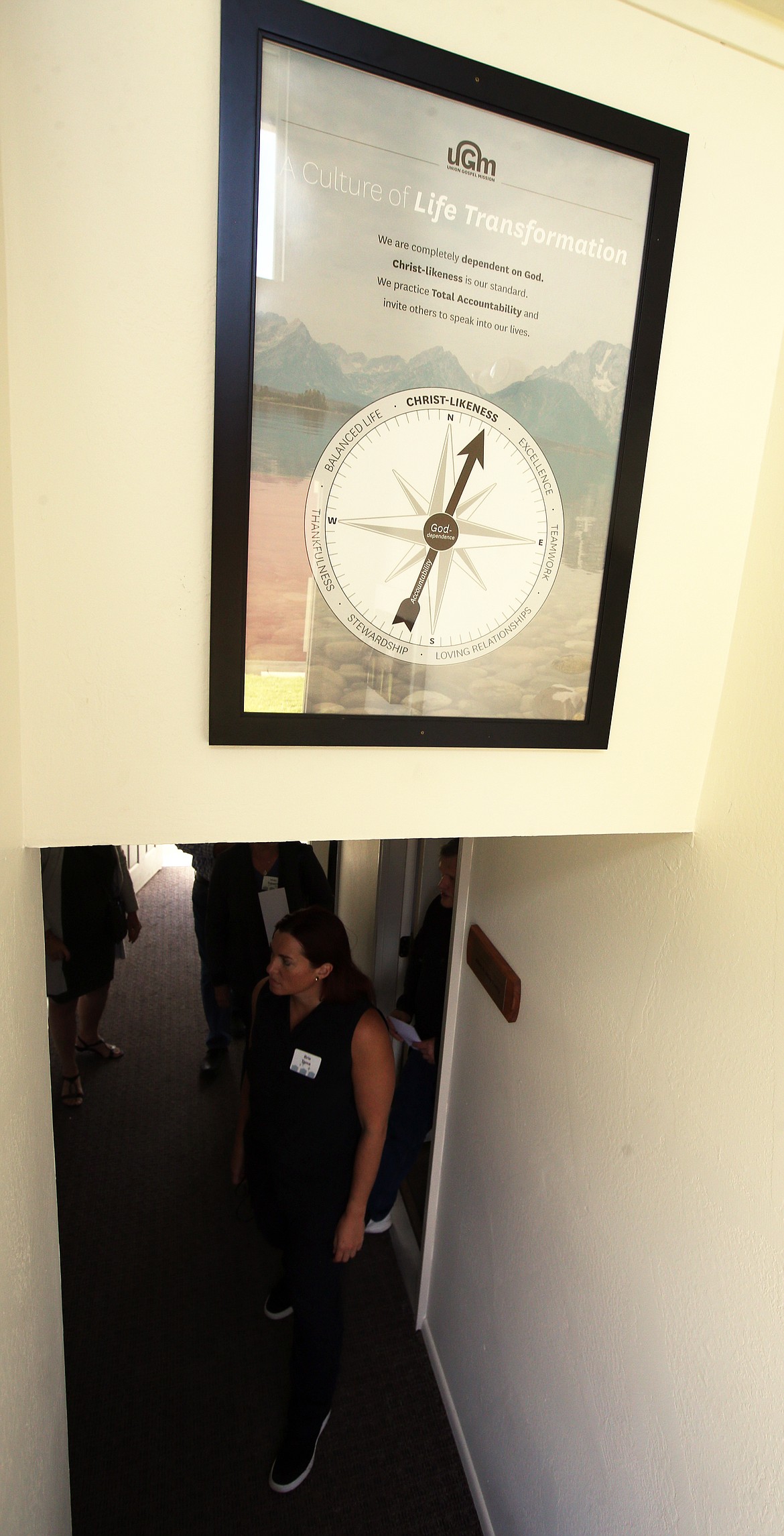 Visitors tour Union Gospel Mission's renovated Dennler Apartments in Coeur d'Alee on Thursday.