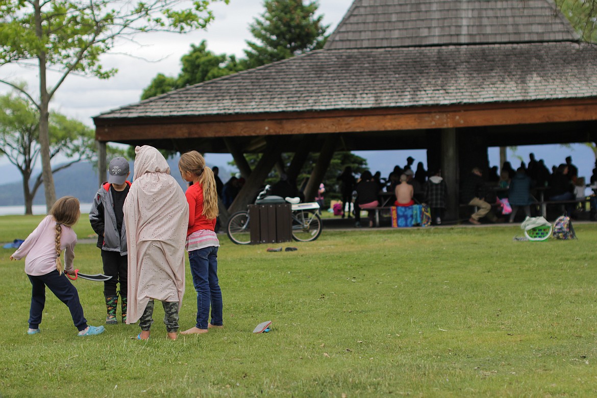 Students play as families gather under the Gazebo at City Beach for the annual Homeschool Academy party on Friday.