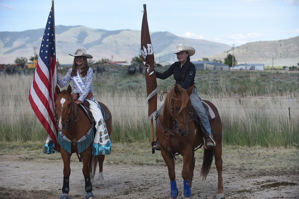 Real Cowboy Association Montana Pro Rodeo Queen Megan Tutvedt, left, and Brash Rodeo’s Dylann Billington prepare to enter the arena Saturday evening at the Hot Springs Rodeo. (Scott Shindledecker/Valley Press)