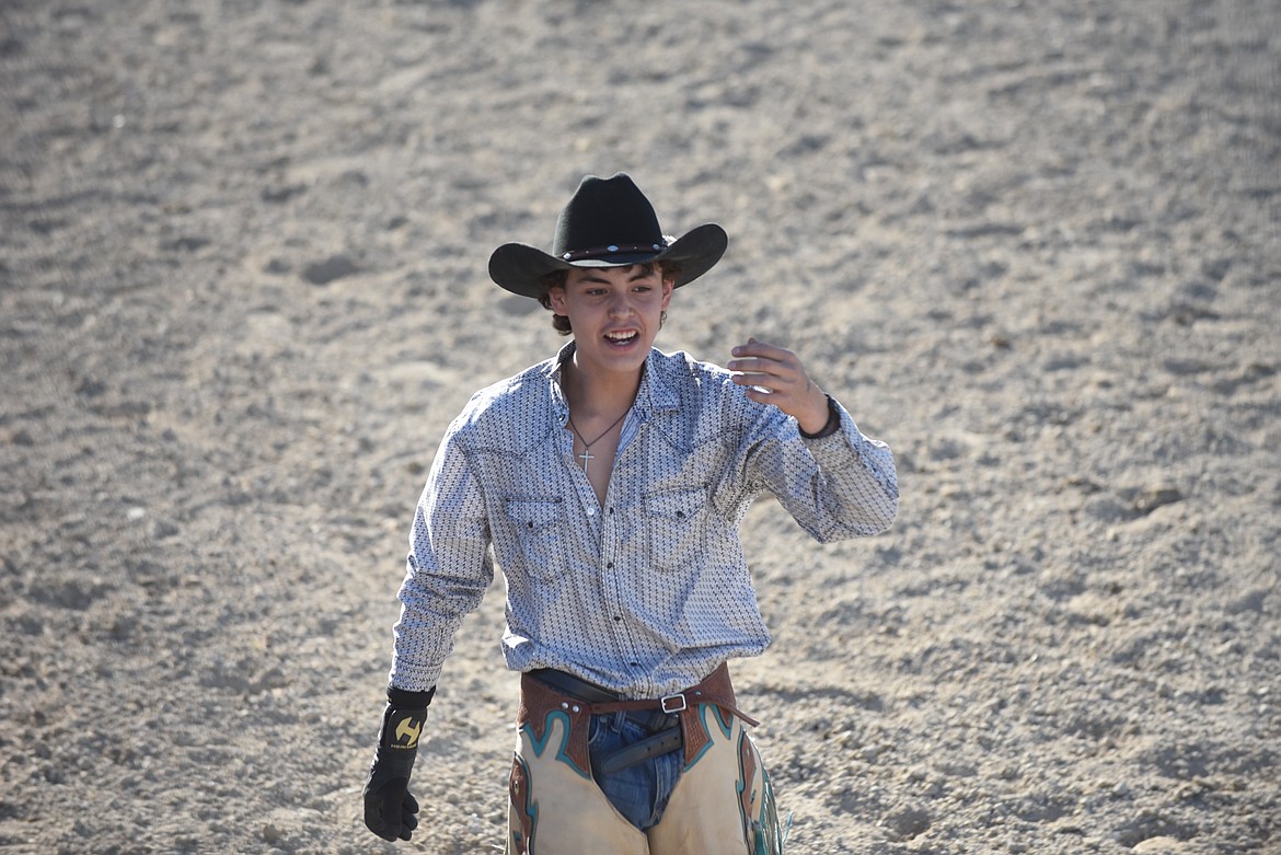 Davyn Daroche celebrates his ride at last Saturday’s Hot Springs Rodeo during the ranch broncs event. (Scott Shindledecker/Valley Press)