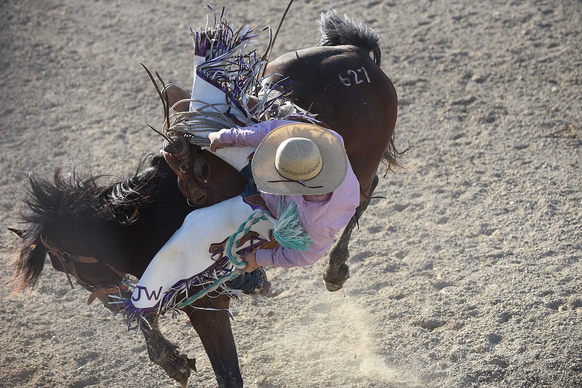 Cowboy Jace Gibron had his hands full during the ranch bronc event last Saturday at the Hot Springs Rodeo. (Scott Shindledecker/Valley Press)