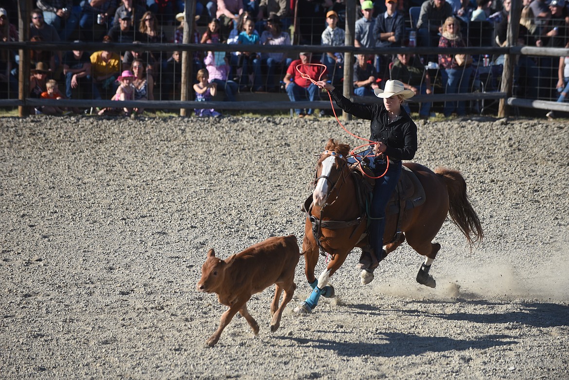 Cowgirl Mary Heaton closes in on a calf during the breakaway event last Saturday at the Hot Springs Rodeo. (Scott Shindledecker/Valley Press)