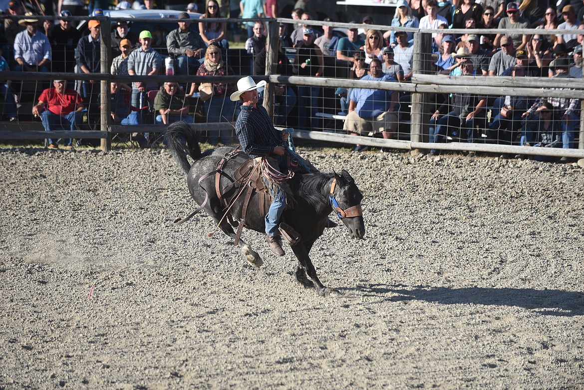 Shea Miller worked hard to remain on his mount during the ranch bronc event last Saturday at the Hot Springs Rodeo. (Scott Shindledecker/Valley Press)