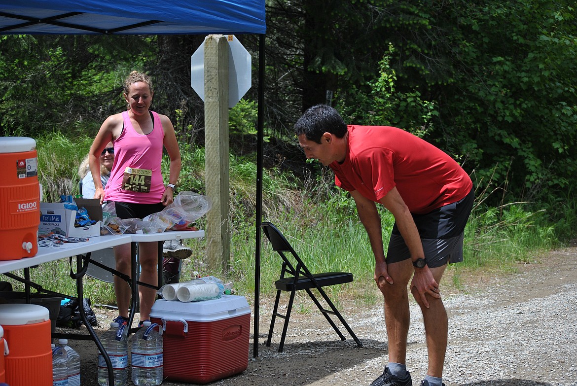 Cameron Harvey from the husband and wife relay team “Lightning Fast Duo,” reached the Ward Creek aid station mid-afternoon on Saturday to catch his breath and trade off with his wife Lesley Harvey. The couple is from Spokane but Lesley grew up in Bigfork. Cameron stated, "For many years we've talked about doing this race especially with the drives back and forth we see this route along the way, I'm glad we finally did it." The Harveys completed 50 miles from Mullan, Idaho to St. Regis as part of the longest running course the Trail Rail Run offers. Trading off every 10 miles or so Lelsey shared, "Cameron did the 8 miles up the mountain to Lookout Pass, and then I did the next 9 going back down." Lesley then finished off the duo's tag team efforts crossing the finish line at the St. Regis park completing the race in 6:45. (Amy Quinlivan/Mineral Independent)