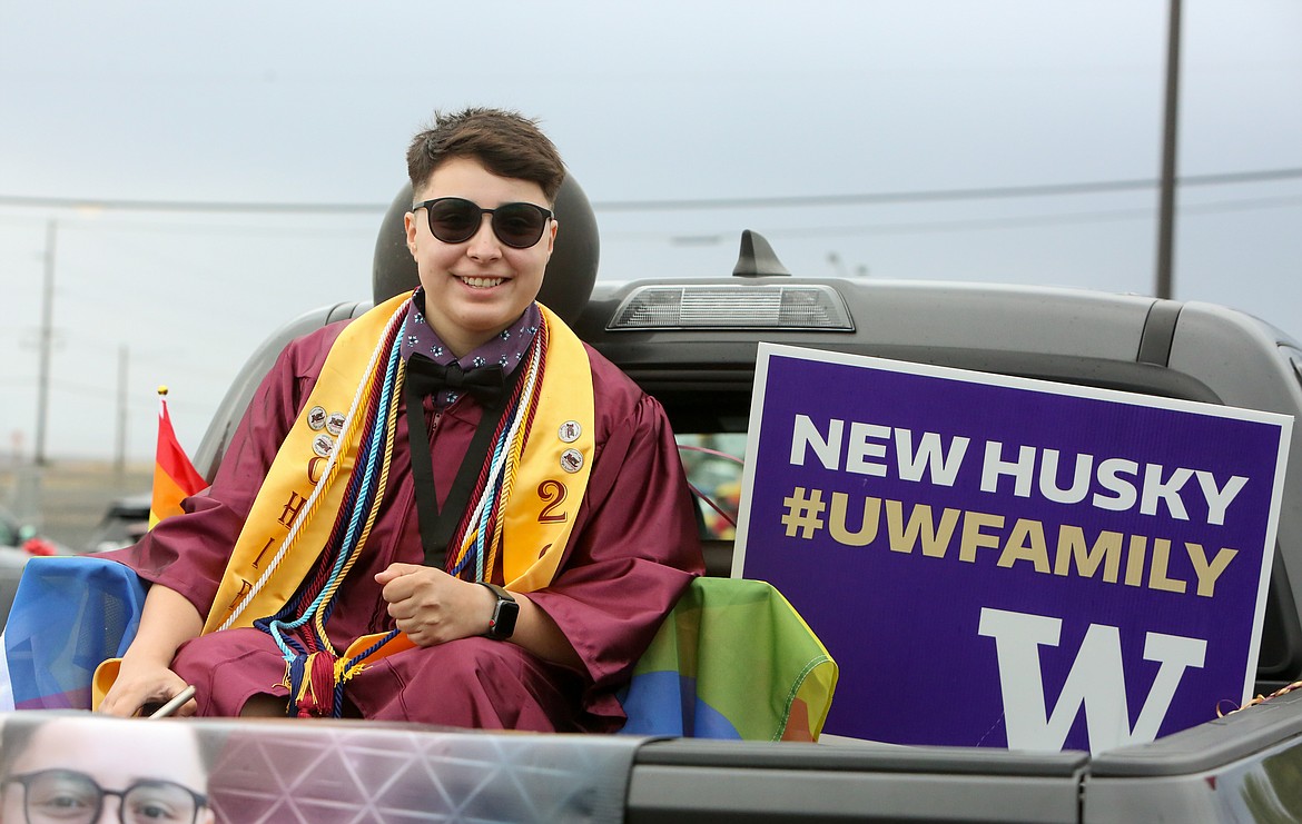 Graduating senior Ahtziri Guzman poses for a photo as she waits for the Moses Lake High School graduation parade to kick off on Friday afternoon at the Grant County Fairgrounds.