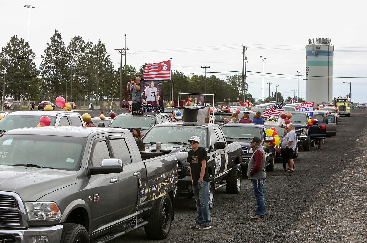 Cars line the parking lot at Grant County Fairgrounds as graduates and families arrive for the 2021 Moses Lake High School graduation parade Friday, June 11.