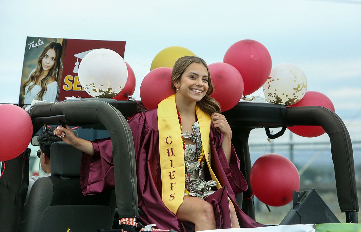 Thalia Garza smiles as she heads off down Airway Drive Northeast as part of the 2021 Moses Lake High School graduation parade ceremony on Friday afternoon, June 11.