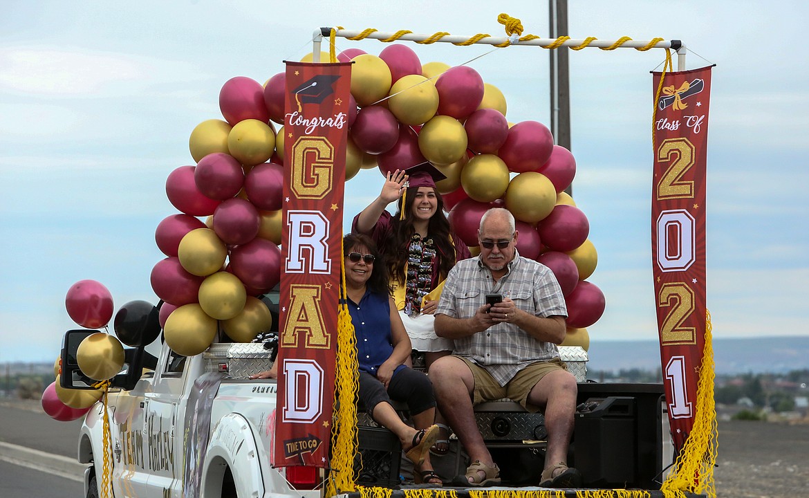 Moses Lake High School graduate Harley Raymond and her parents make their down Airway Drive Northeast after leaving Grant County Fairgrounds in the graduation parade ceremony on Friday, June 11.
