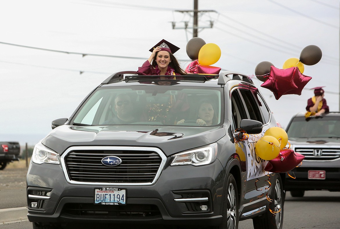 2021 Moses Lake High School graduates and their families make their way down Airway Drive Northeast as the graduation parade ceremony kicks off on Friday afternoon, June 11.