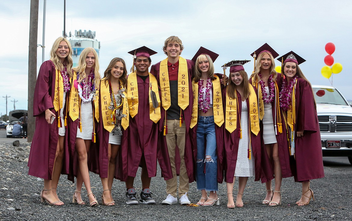 Members of the 2021 Moses Lake High School graduating class gather together for a photo in the parking lot at the Grant County Fairgrounds on Friday afternoon, June 11.