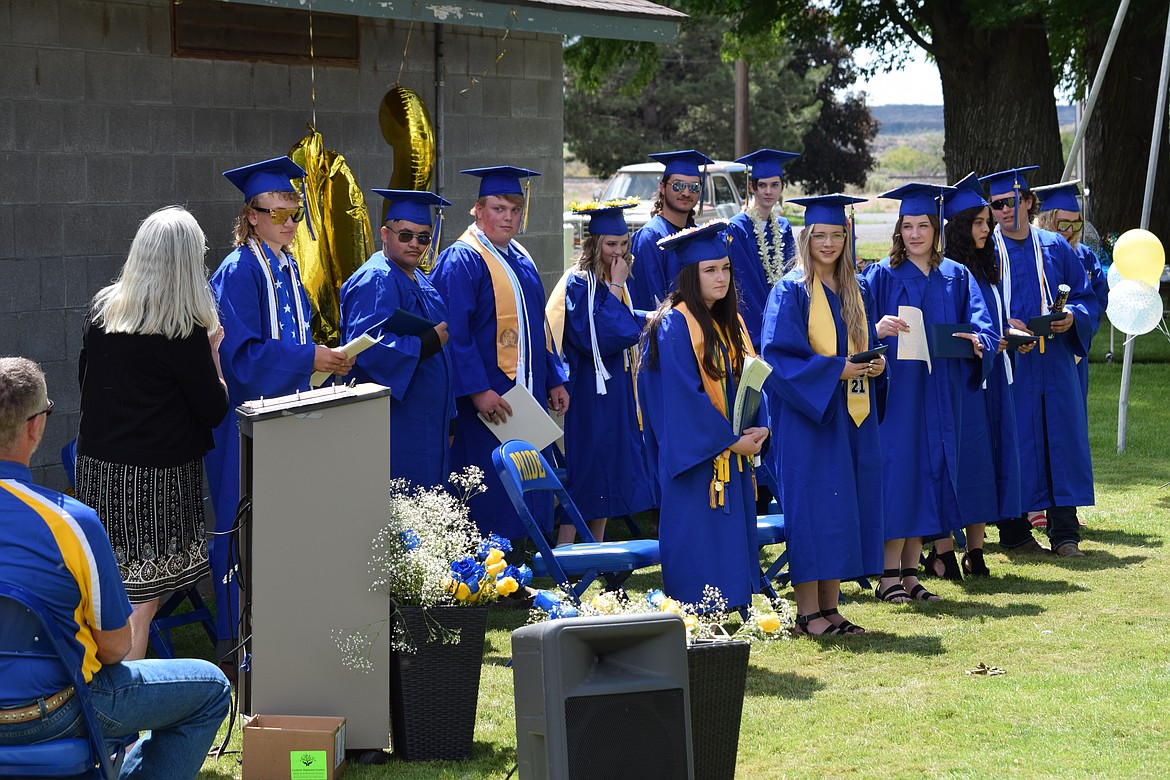 The members of the Wilson Creek High School graduating class of 2021 — all 12 of them — at the school’s commencement exercise in Wilson Creek Park on Saturday, June 12.