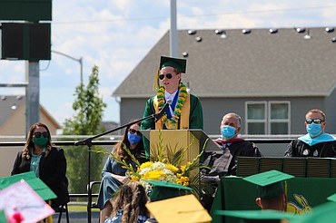 Salutatorian Drew Rigby addresses his class at Quincy High School’s Saturday commencement.