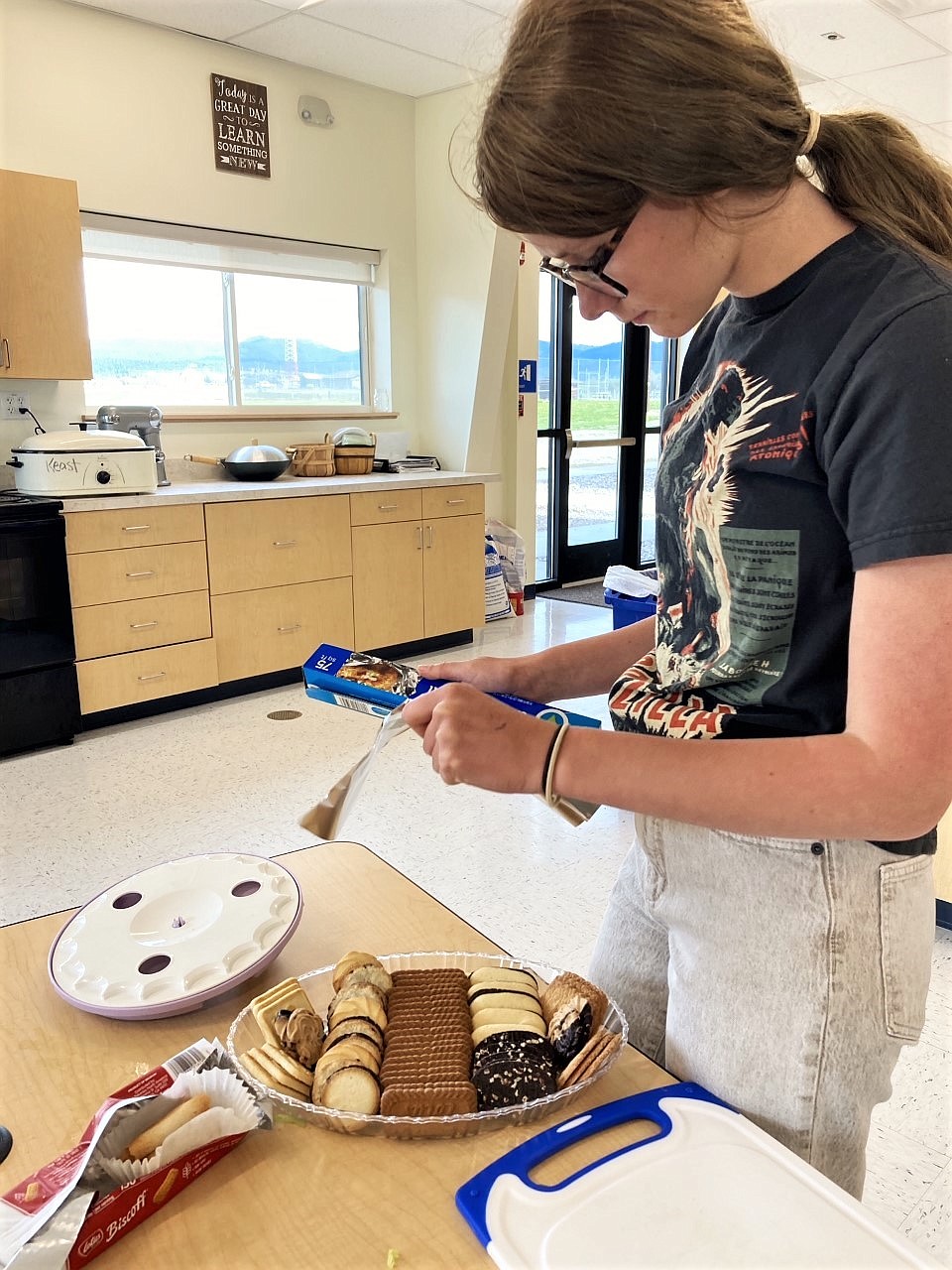 Lanie Keast prepares a dessert plate for a meal delivery to thank the St. Luke night nursing staff. Lanie led a team that landed a small grant from Arlee's Spring House Resource to buy the food for two dinners. (Courtesy photo)
