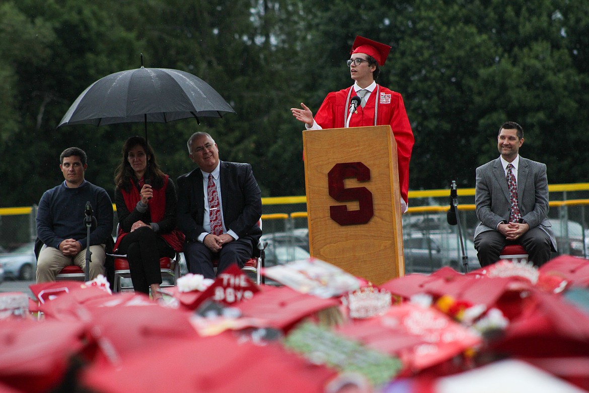 Salutatorian Connor Bird speaks to the crowd Friday at War Memorial Field.