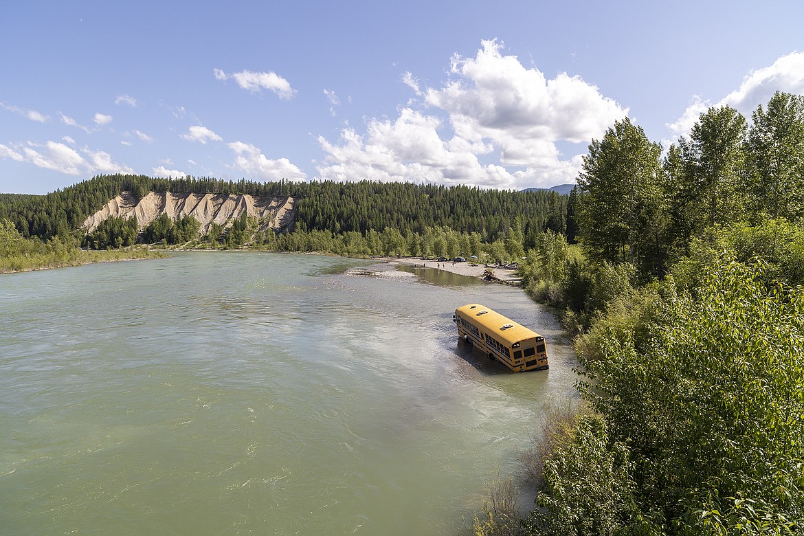 A bus sits in the Flathead River at Blankenship Tuesday.