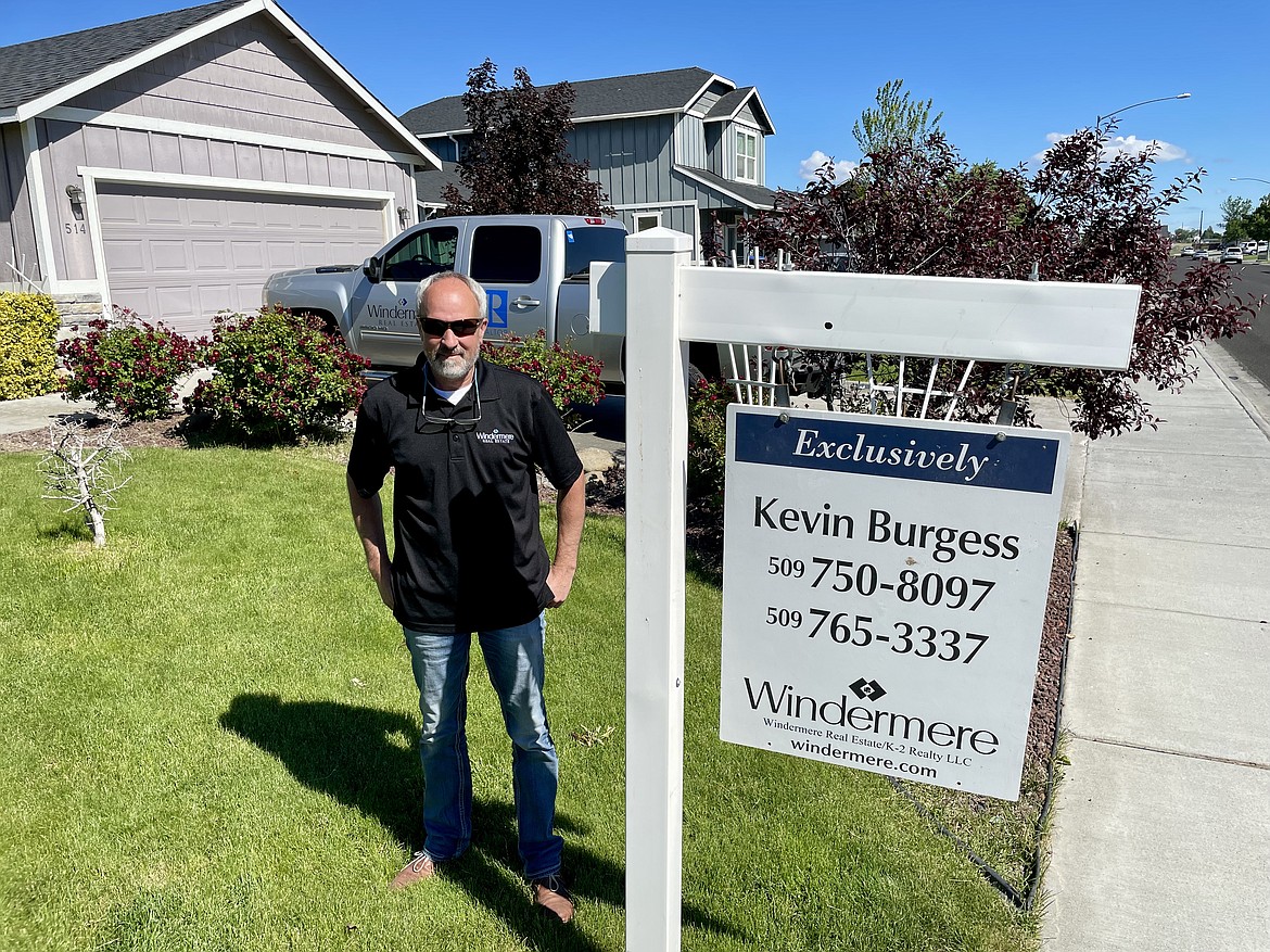 Moses Lake real estate broker Kevin Burgess, who is the president of the Moses Lake-Othello Association of Realtors in 2021, stands outside a property he has listed for sale in Moses Lake. And, given the current market, it has likely already sold.