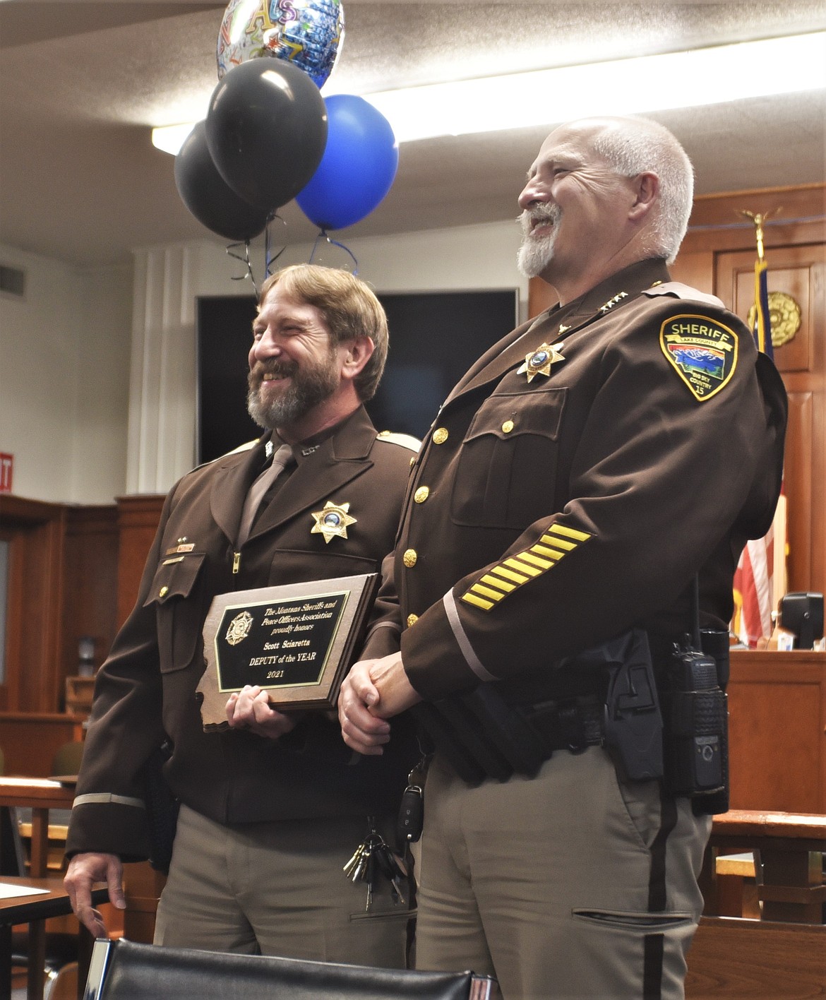 Lake County Sheriff's Department Det. Scott Sciaretta, left, poses for photos with Sheriff Don Bell on Thursday inside Lake County District Court. Det. Sciaretta received the state Deputy of the Year award. (Scot Heisel/Lake County Leader)