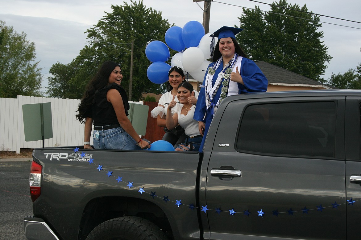 Family and friends came along for the ride during a car parade before Warden High School graduation June 11.