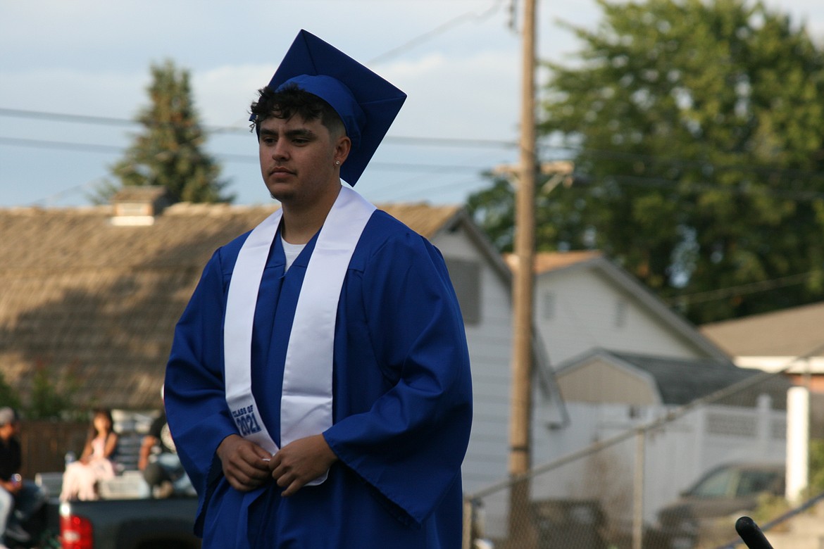 A Warden High School senior walks across the stage during the June 11 graduation ceremony.