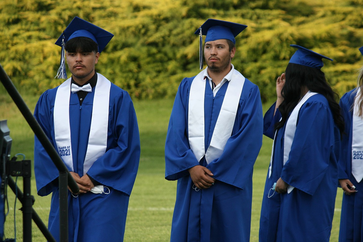 Seniors wait to take the walk across the stage and receive their diplomas during Warden High School graduation June 11.