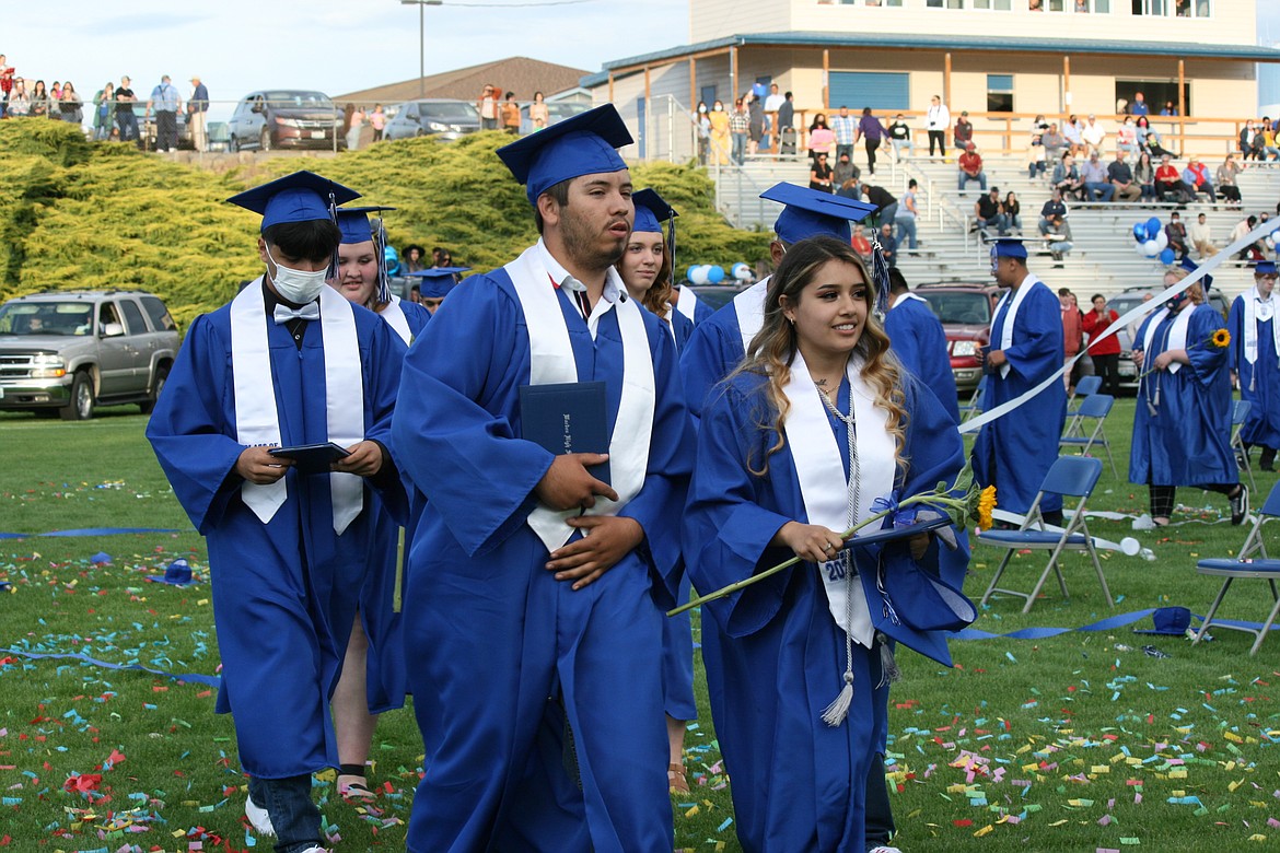 Newly graduated Warden High School seniors leave the stadium at the end of the June 11 ceremony.