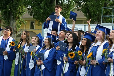 Warden High School seniors show off their diplomas in a class picture after graduation ceremonies June 11.
