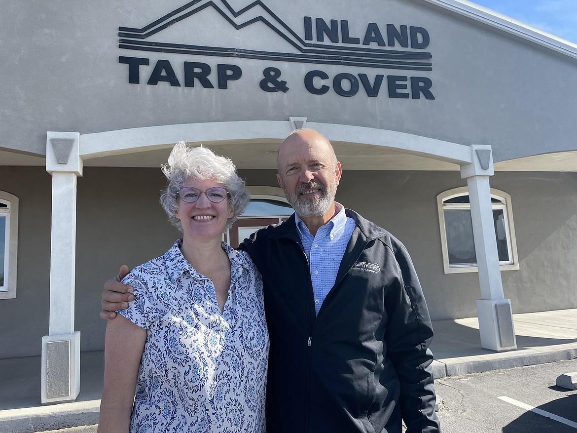 Carol and Glen Knopp outside the administrative offices of Inland Tarp and Cover. The company founder, Glen has set up a trust to give employees shares in the company.