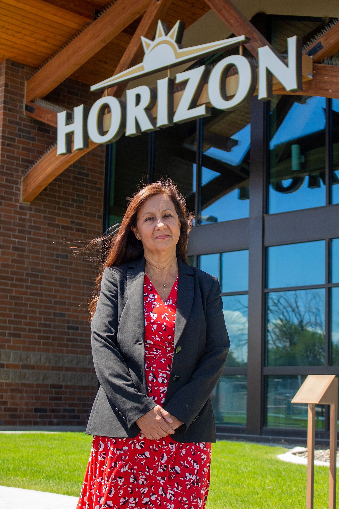 Juanita Richards, north central regional manager for Horizon Credit Union, sits at her desk in her office in Moses Lake on June 10.