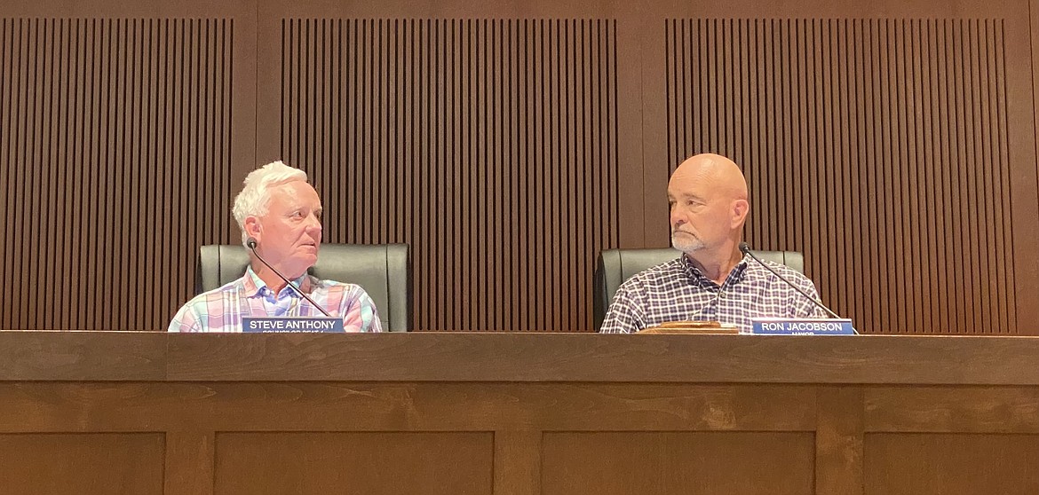 Councilman Steve Anthony, left, and Mayor Ron Jacobson give each other a look during deliberations on the 12-acre riverfront annexation before voicing their support. (MADISON HARDY/Press)