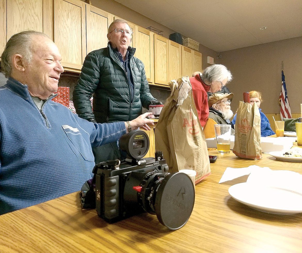 Ed Gilliland, left, with Gary Harding, Dani Dobyns and George McFarland in this photo during a Glacier Camera Club meeting in 2018. (Adele Scholl photo)