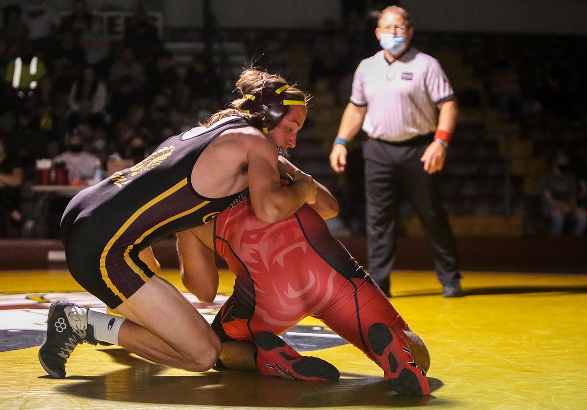 Moses Lake High School senior Camron Regan battles to gain position with his opponent on the mat in the final home dual of the season for the Chiefs on Tuesday evening.