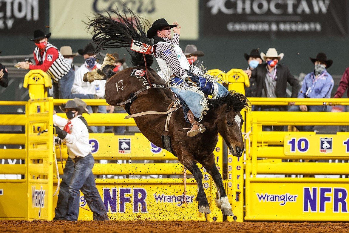 Professional rodeo cowboy Richmond Champion competes in the bareback riding event at the 2020 PRCA National Finals Rodeo in Arlington, Texas.