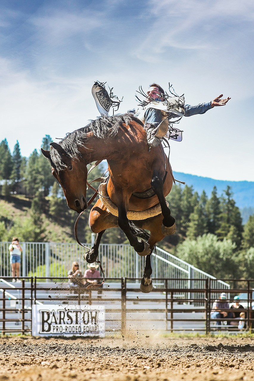 Competitor Austin Foss holds on as best he can inside the arena at the 2021 Riggin’ Rally Qualifier in Darby, Montana, in early June.